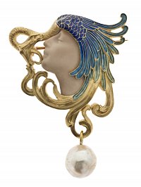 Broche tête de femme, serpent et aile